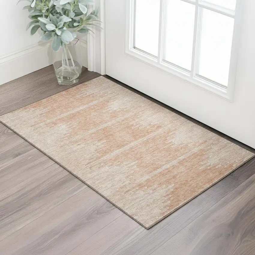 Salmon And Ivory Abstract Washable Area Rug With UV Protection Photo 1