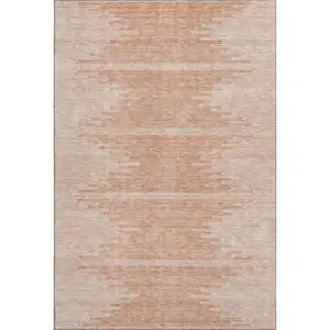 Photo of Salmon And Ivory Abstract Washable Area Rug With UV Protection