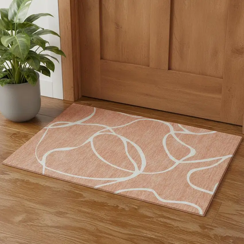 Salmon And Ivory Abstract Washable Area Rug With UV Protection Photo 1