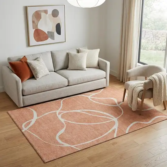 Salmon And Ivory Abstract Washable Area Rug With UV Protection Photo 1