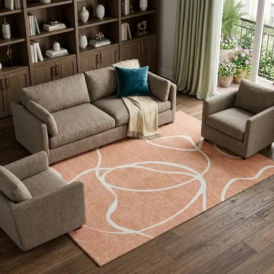 Salmon And Ivory Abstract Washable Area Rug With UV Protection Photo 1
