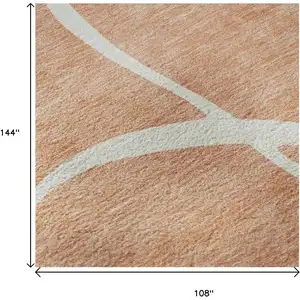 Photo of Salmon And Ivory Abstract Washable Area Rug With UV Protection