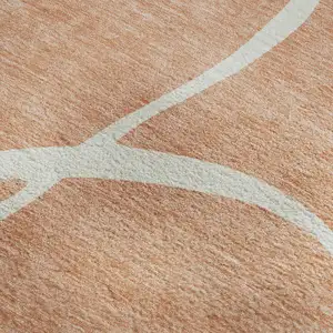 Photo of Salmon And Ivory Abstract Washable Area Rug With UV Protection
