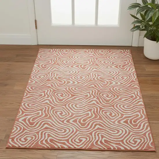 Salmon And Ivory Abstract Washable Area Rug With UV Protection Photo 2