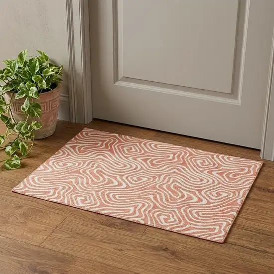 Salmon And Ivory Abstract Washable Area Rug With UV Protection Photo 1