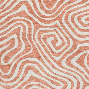 Photo of Salmon And Ivory Abstract Washable Area Rug With UV Protection