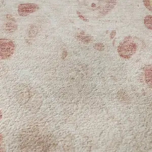 Photo of Salmon And Ivory Abstract Washable Area Rug With UV Protection