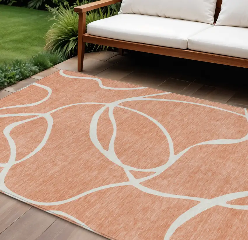 Salmon And Ivory Abstract Washable Indoor Outdoor Area Rug Photo 1