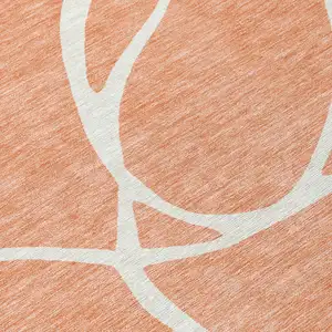 Photo of Salmon And Ivory Abstract Washable Indoor Outdoor Area Rug