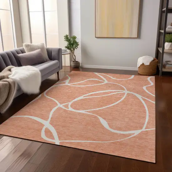 Salmon And Ivory Abstract Washable Indoor Outdoor Area Rug Photo 9