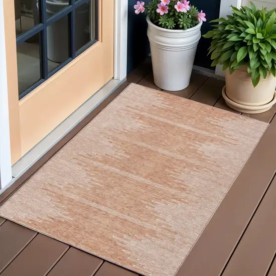 Salmon And Ivory Abstract Washable Indoor Outdoor Area Rug Photo 1