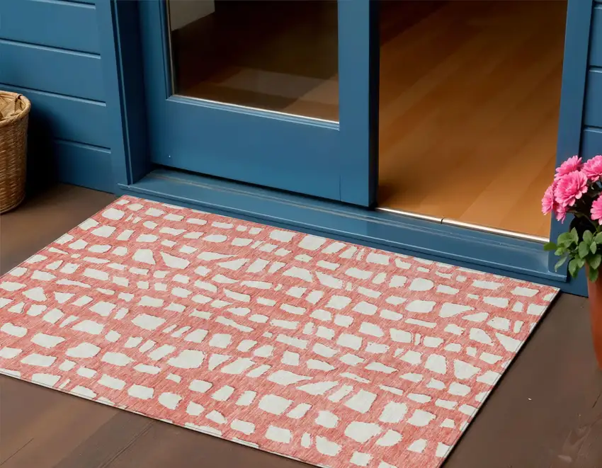 Salmon And Ivory Abstract Washable Indoor Outdoor Area Rug Photo 1