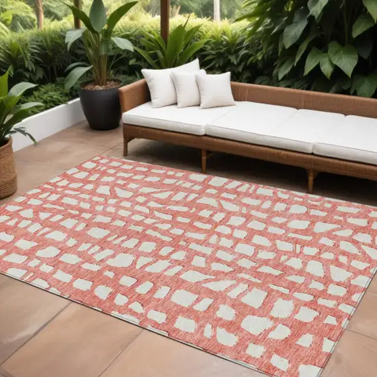 Salmon And Ivory Abstract Washable Indoor Outdoor Area Rug Photo 1