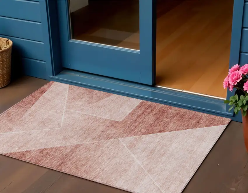 Salmon And Ivory Abstract Washable Indoor Outdoor Area Rug Photo 1