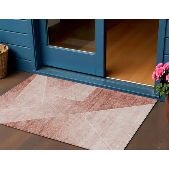 Salmon And Ivory Abstract Washable Indoor Outdoor Area Rug Photo 1