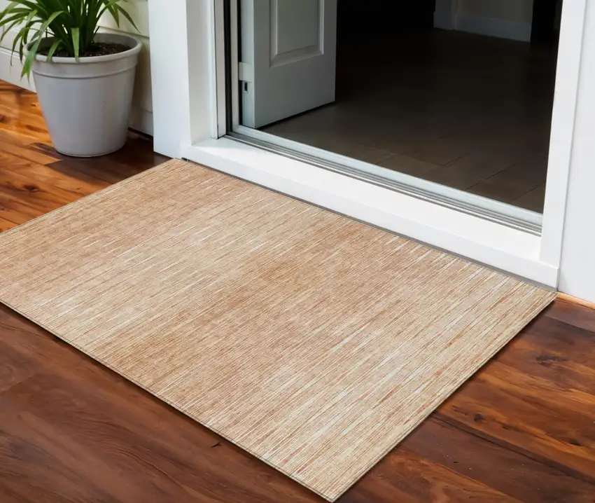 Salmon And Ivory Abstract Washable Indoor Outdoor Area Rug Photo 1