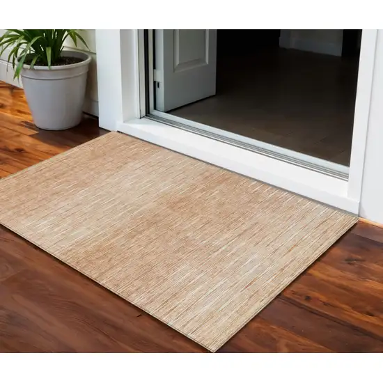 Salmon And Ivory Abstract Washable Indoor Outdoor Area Rug Photo 1