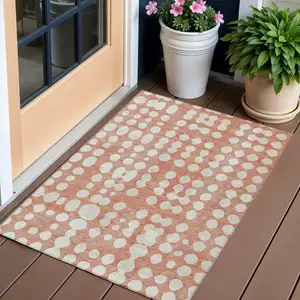 Photo of Salmon And Ivory Abstract Washable Indoor Outdoor Area Rug