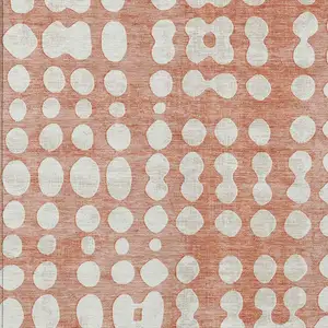 Photo of Salmon And Ivory Abstract Washable Indoor Outdoor Area Rug