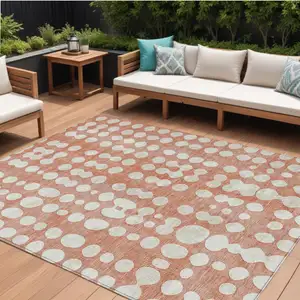 Photo of Salmon And Ivory Abstract Washable Indoor Outdoor Area Rug