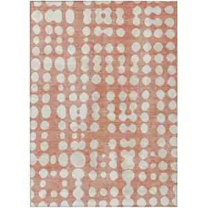 Photo of Salmon And Ivory Abstract Washable Indoor Outdoor Area Rug