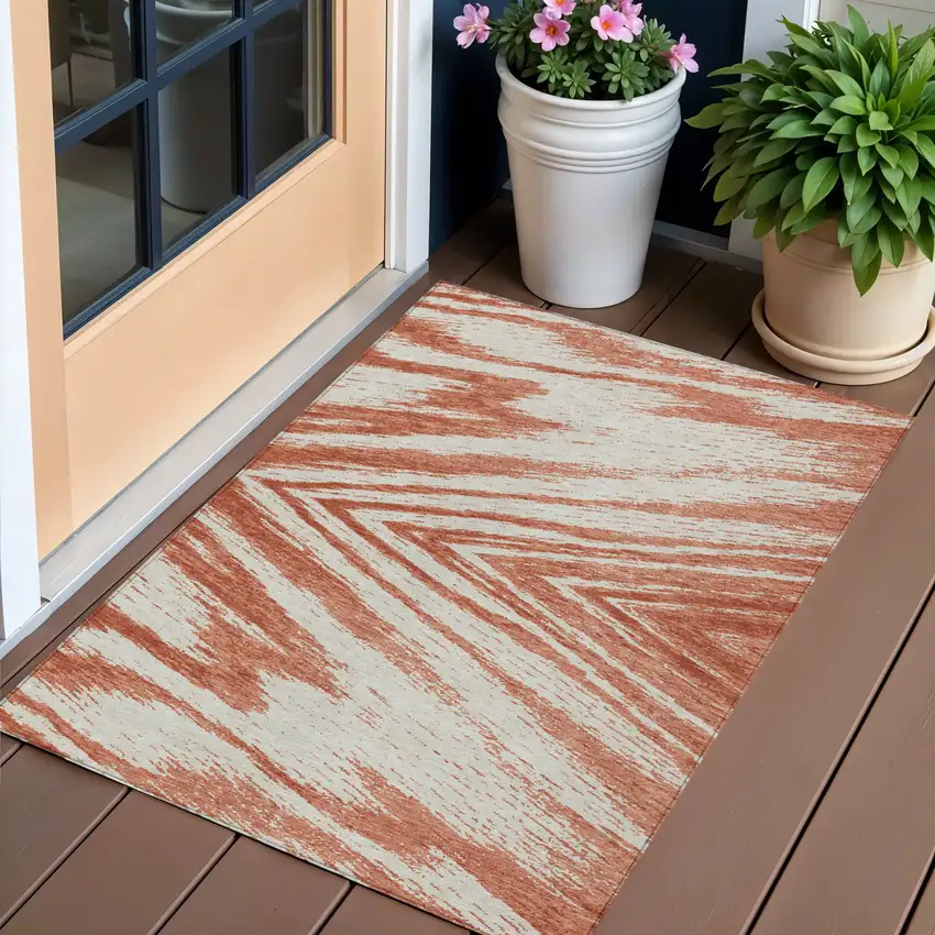 Salmon And Ivory Abstract Washable Indoor Outdoor Area Rug Photo 1
