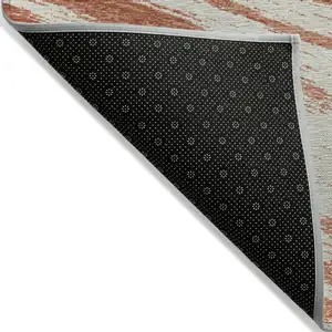 Photo of Salmon And Ivory Abstract Washable Indoor Outdoor Area Rug