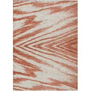 Photo of Salmon And Ivory Abstract Washable Indoor Outdoor Area Rug