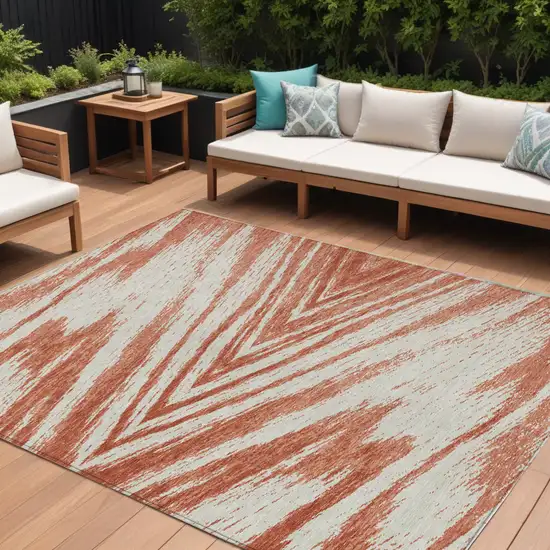 Salmon And Ivory Abstract Washable Indoor Outdoor Area Rug Photo 1