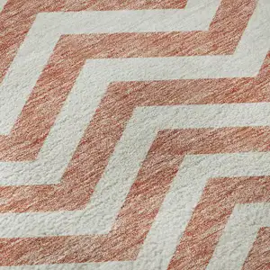 Photo of Salmon And Ivory Chevron Washable Area Rug With UV Protection