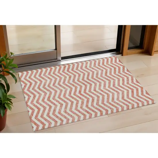 Salmon And Ivory Chevron Washable Indoor Outdoor Area Rug Photo 1