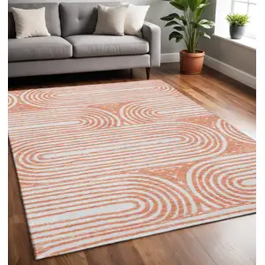Photo of Salmon And Ivory Geometric Washable Area Rug With UV Protection