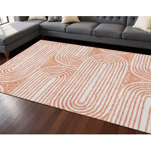 Photo of Salmon And Ivory Geometric Washable Area Rug With UV Protection
