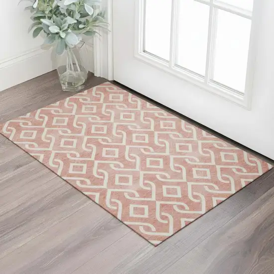 Salmon And Ivory Geometric Washable Area Rug With UV Protection Photo 1