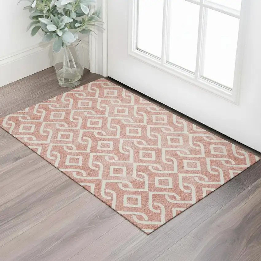 Salmon And Ivory Geometric Washable Area Rug With UV Protection Photo 1