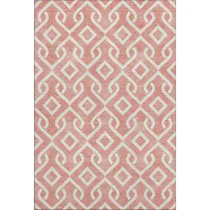 Photo of Salmon And Ivory Geometric Washable Area Rug With UV Protection