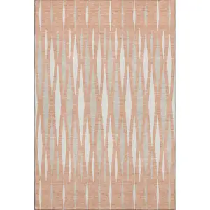 Photo of Salmon And Ivory Geometric Washable Area Rug With UV Protection