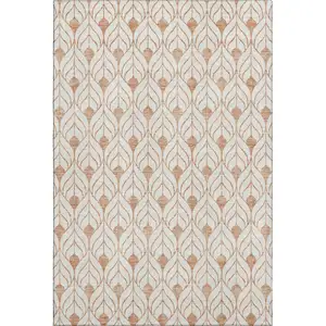 Photo of Salmon And Ivory Geometric Washable Area Rug With UV Protection