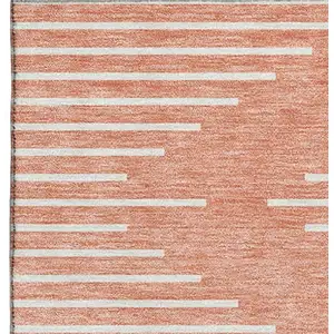 Photo of Salmon And Ivory Geometric Washable Area Rug With UV Protection