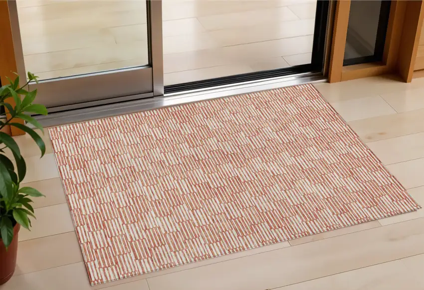 Salmon And Ivory Geometric Washable Indoor Outdoor Area Rug Photo 1