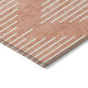 Photo of Salmon And Ivory Geometric Washable Indoor Outdoor Area Rug