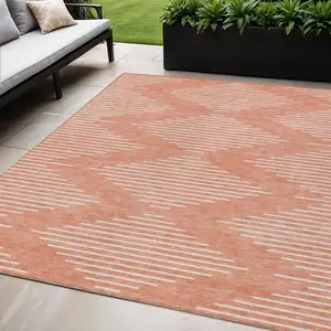 Photo of Salmon And Ivory Geometric Washable Indoor Outdoor Area Rug