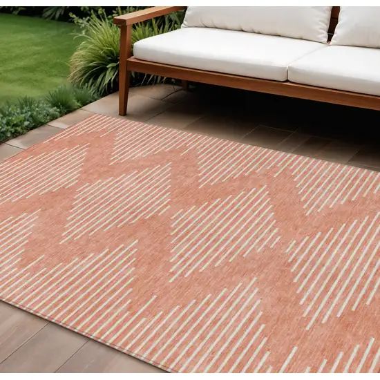 Salmon And Ivory Geometric Washable Indoor Outdoor Area Rug Photo 1