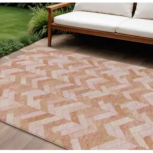 Photo of Salmon And Ivory Geometric Washable Indoor Outdoor Area Rug