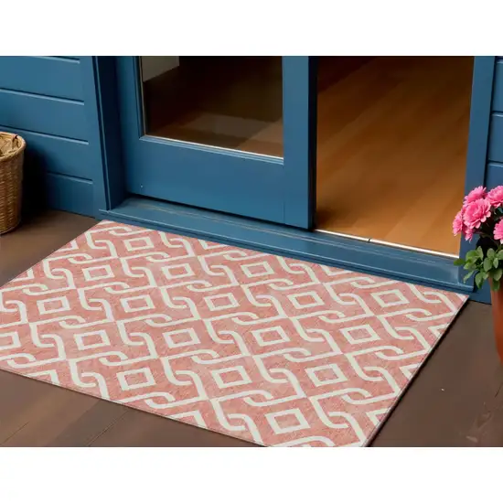 Salmon And Ivory Geometric Washable Indoor Outdoor Area Rug Photo 1