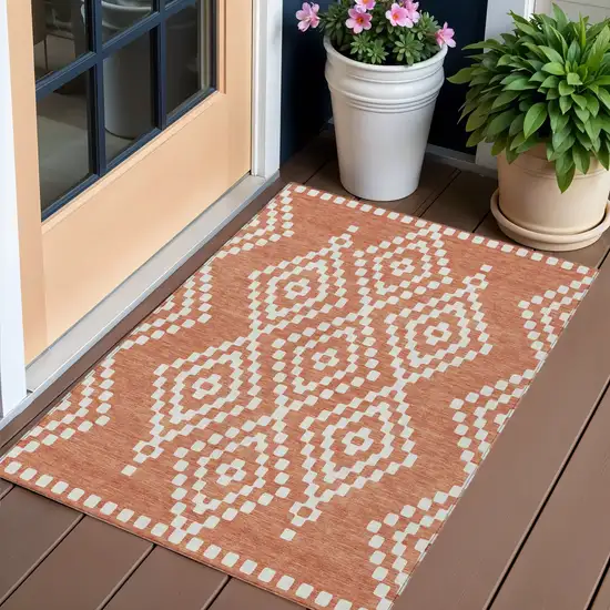 Salmon And Ivory Geometric Washable Indoor Outdoor Area Rug Photo 1