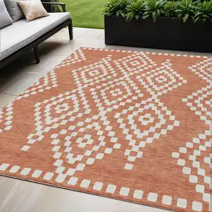 Photo of Salmon And Ivory Geometric Washable Indoor Outdoor Area Rug