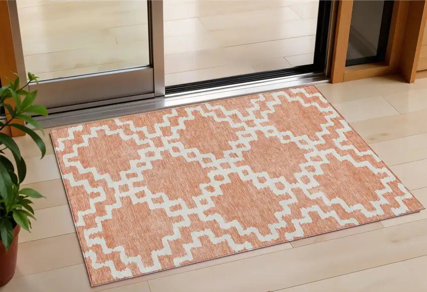 Salmon And Ivory Geometric Washable Indoor Outdoor Area Rug Photo 1