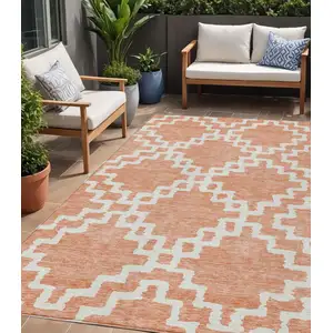 Photo of Salmon And Ivory Geometric Washable Indoor Outdoor Area Rug