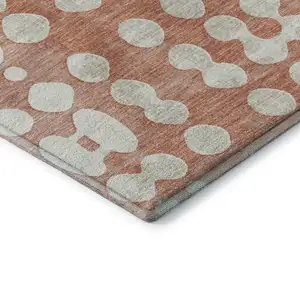 Photo of Salmon And Ivory Polka Dot Washable Area Rug With UV Protection